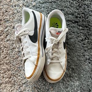 Nike White and Black Sneakers with Gold Accents